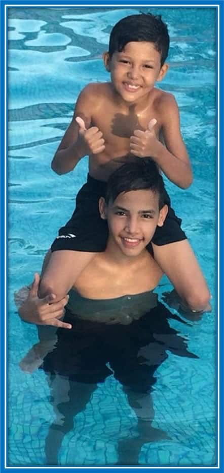 Young Deivid and his sister, Ana Júlia, pictured enjoying their shared passion by the pool, a symbol of their enduring bond and cherished childhood moments.