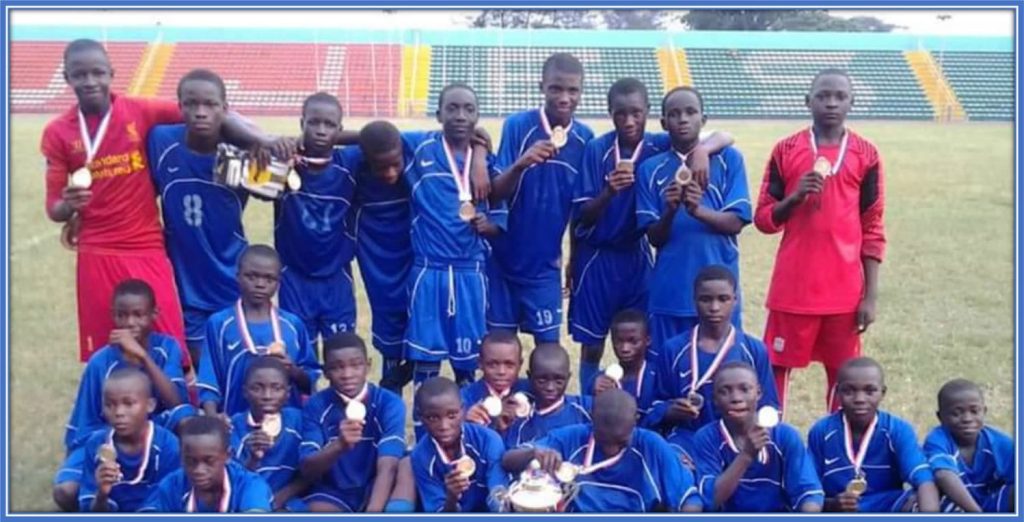 Terem Moffi (pictured fourth right, standing) and teammates proudly showcasing their hard-earned medals. This is a huge testament to their triumphant victory and invaluable contributions on and off the pitch. Credit: Instagram/moffigram_/