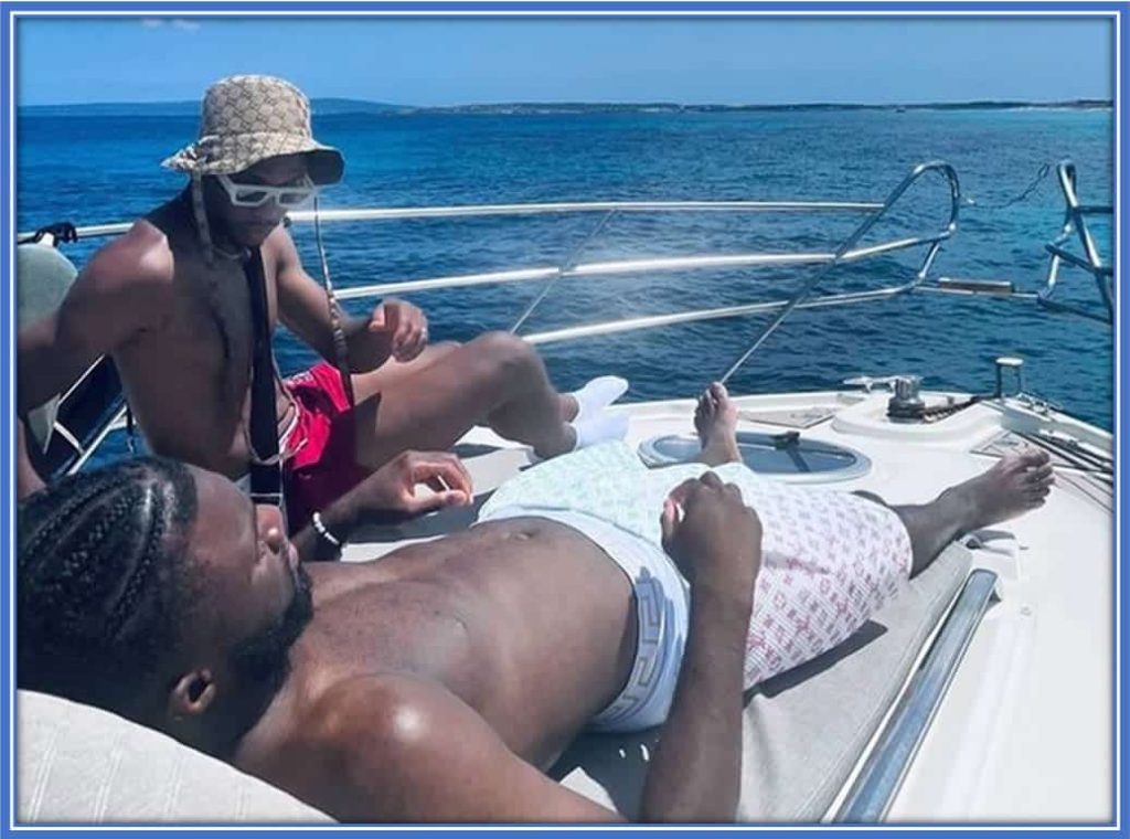 The Nigerian Forward taking a seaside break in July 2022. Beyond the pitch, he relishes travel and the ocean's allure. Credit: instagram.com/moffigram_/