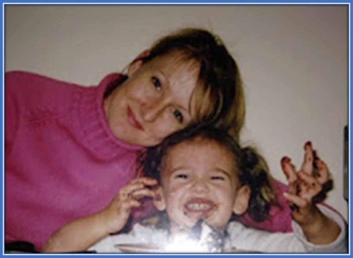 An early childhood photo of Ashleigh Plumptre with her biological mother. Source: Famousnaija.