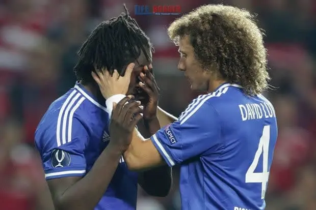 Romelu Lukaku receiving prayers from Pastor David Luiz.