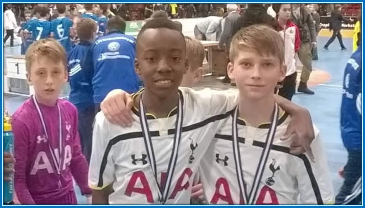 Noni Madueke poses for the photograph with his Spurs friend and goalkeeper.