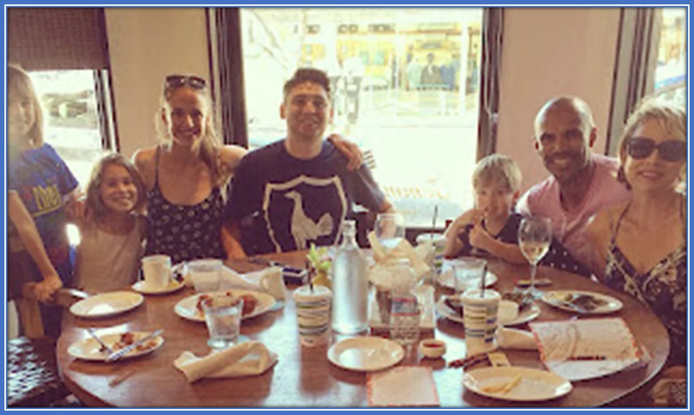 A happy photo of Ashleigh Plumptre's household members at the table. Credit: Famousnaija.