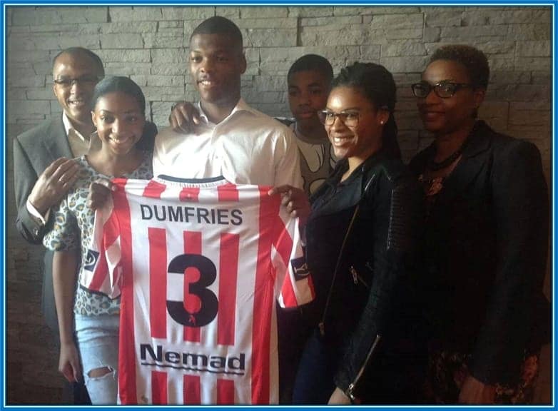 Meet Denzel Dumfries' family as they celebrate with him on the signing of his first professional contract.