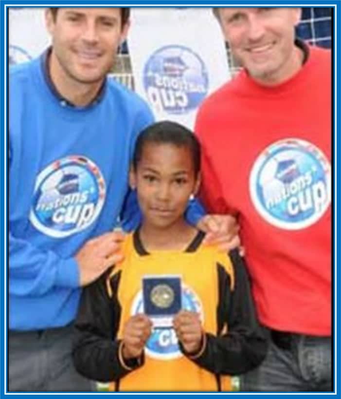 See Antonio with organizers of the Mini-Nations Cup when he was 11. Photo Credit: Birmingham Mail.