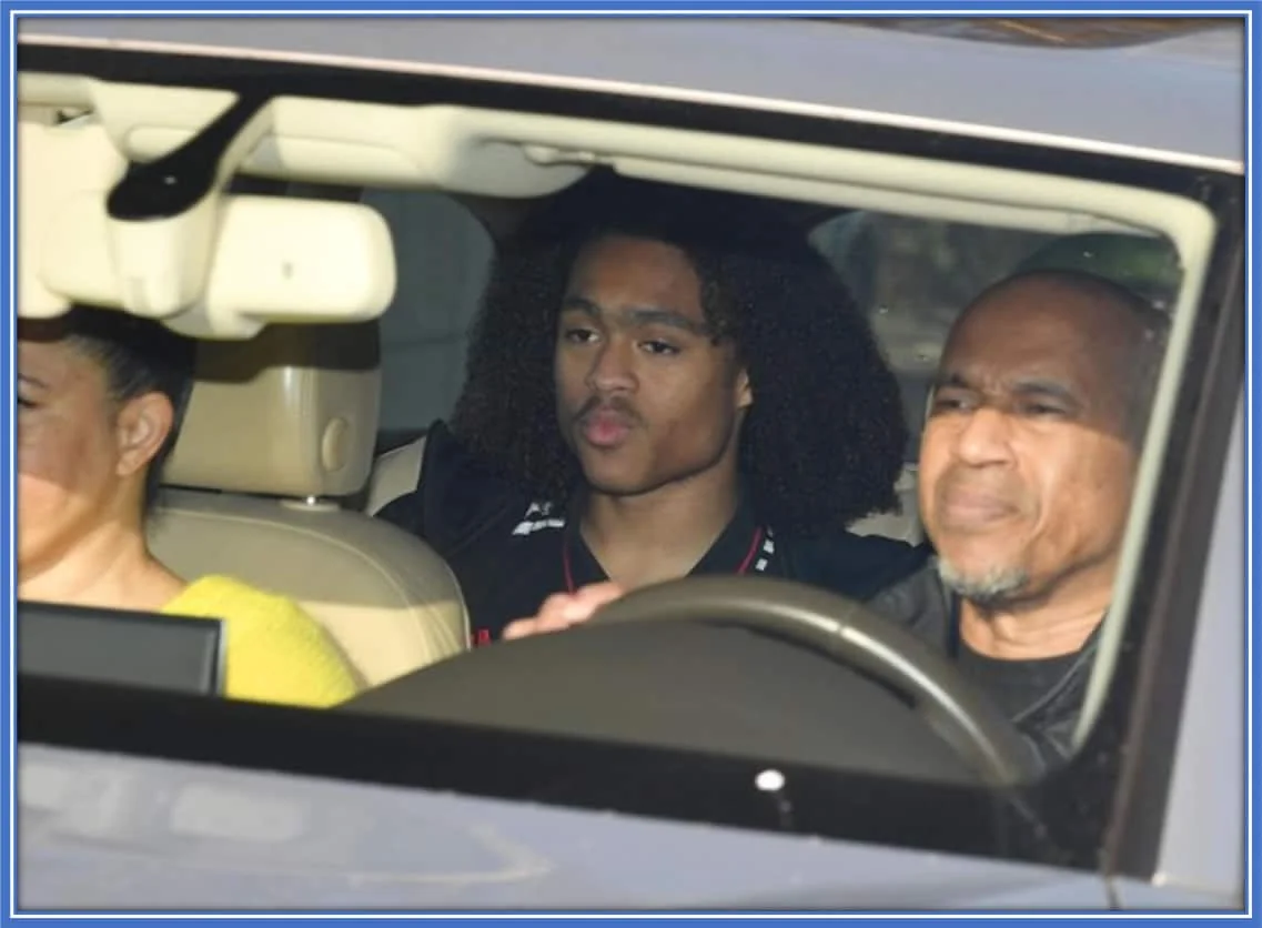 Father-Son Bonding: Tahith Chong gears up for a productive training day at Carrington, courtesy of a memorable ride from his dad. Credit: thesun.co.uk.