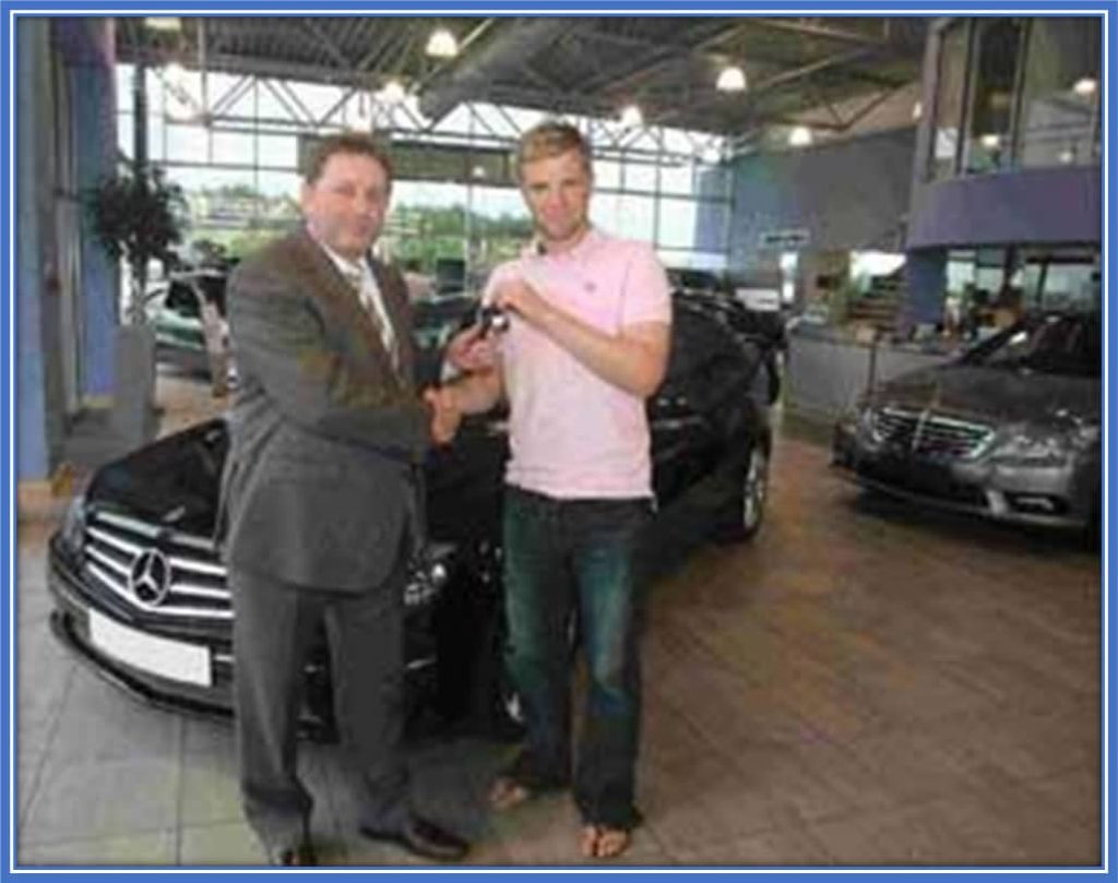 Howe receiving a Mercedes-Benz CLC-Class from Martin Slater.