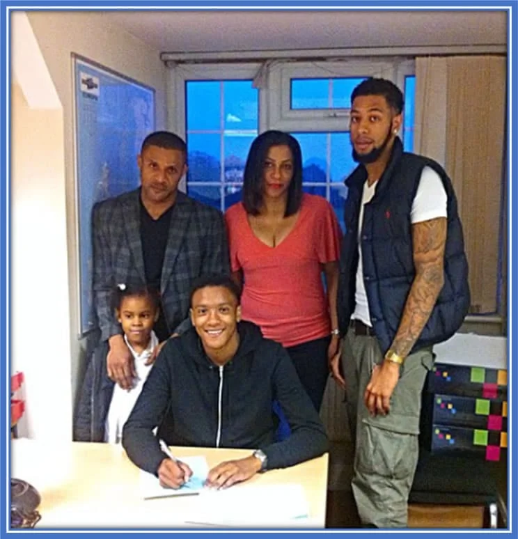 Konsa's Remarkable Journey: Signing His First Contract Surrounded by Unwavering Family Support. Credit: Instagram/ezrikonsa.