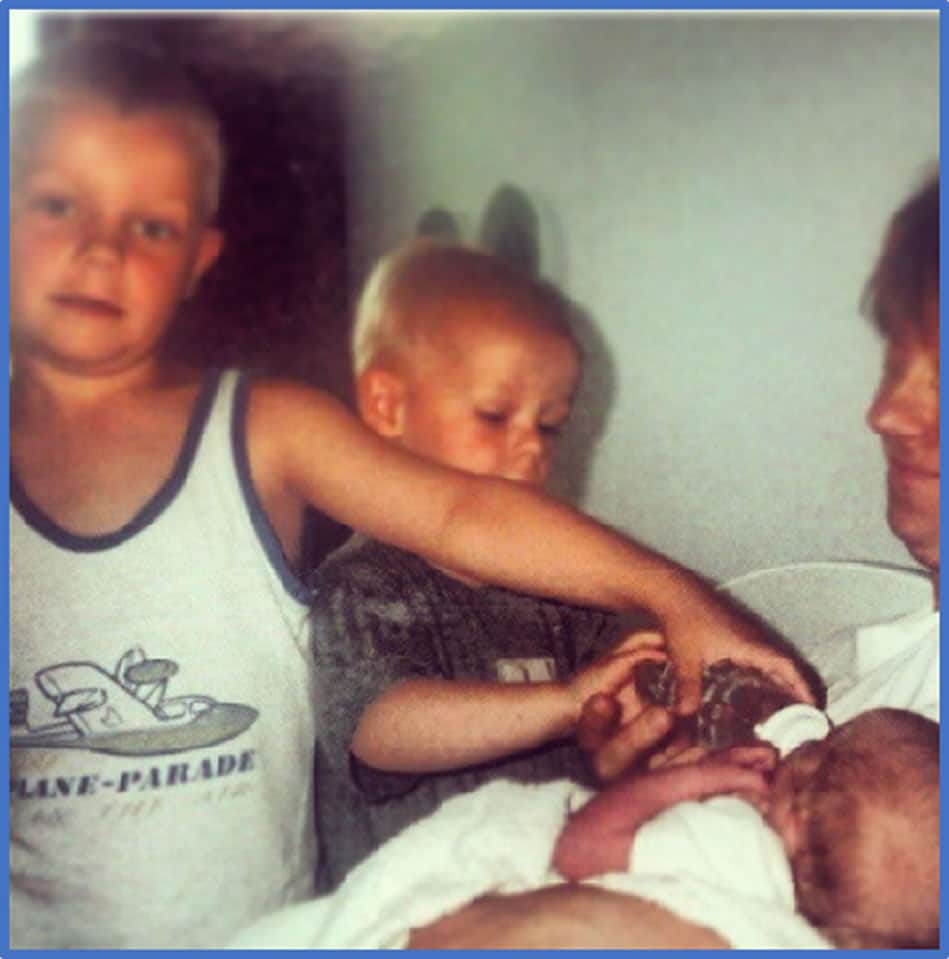 Behold the little third brother in his father's arms as his older siblings surround him. Instagram jpvanhecke.