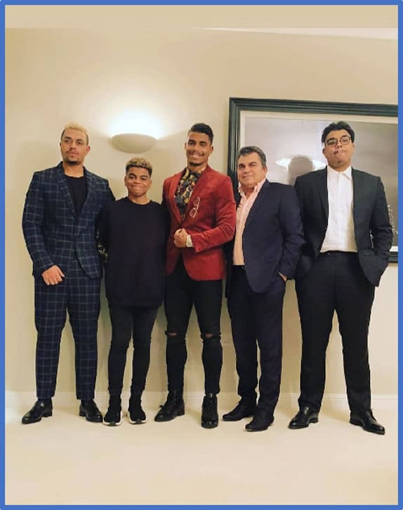 Mario Lemina's four brothers stood proudly with their father. Photo: Instagram lems_family