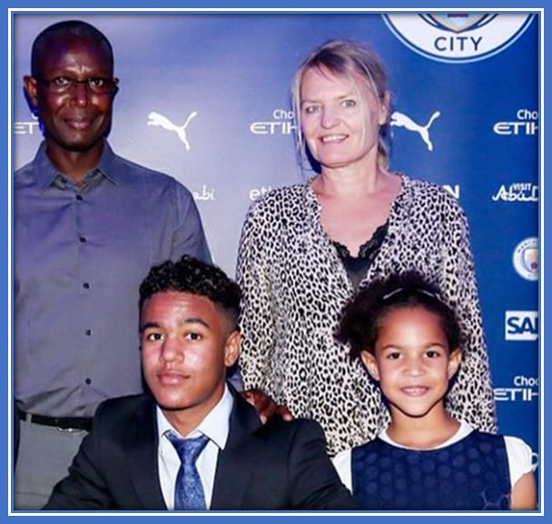 Now, let's introduce you to all members of Oscar Bobb's Family. From left to right, we have his Biological Father, Abdou Bobb, himself, his Mum (Turid Gunnes) and his Baby Sister. Credit: City Report.