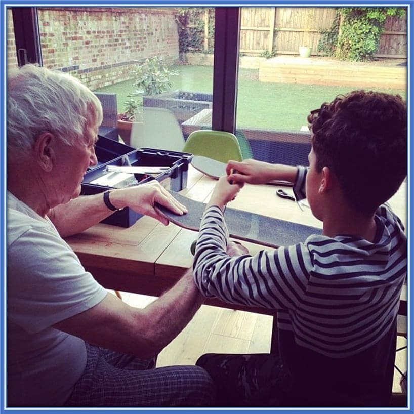 A 12-year-old Brennan Johnson with his maternal grandfather. Alison's Dad gave a helping hand to Brennan, who repaired his faulty skateboard.