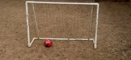 Little Curtis and his peers played street football with borrowed movable goalposts.