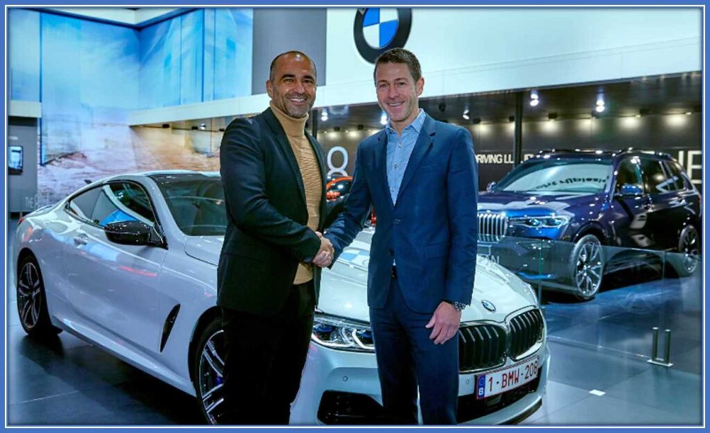 Roberto Martinez is being presented with a brand-new BMW. Image Source: BMWGroup.