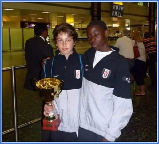 This is Max Kilman holding a trophy - during his early days with Fulham.