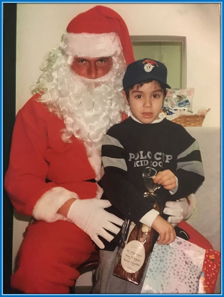 Behold the footballer as a child in the arms of Father Christmas. No doubt it felt good to the young boy in his early years. Source: HLN