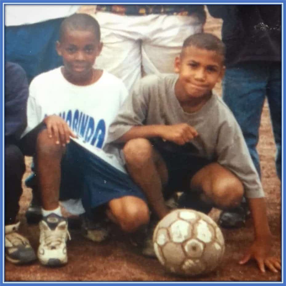 Young Eric Maxim Choupo-Moting as a kid (pictured right) - in his early years with Soccer.