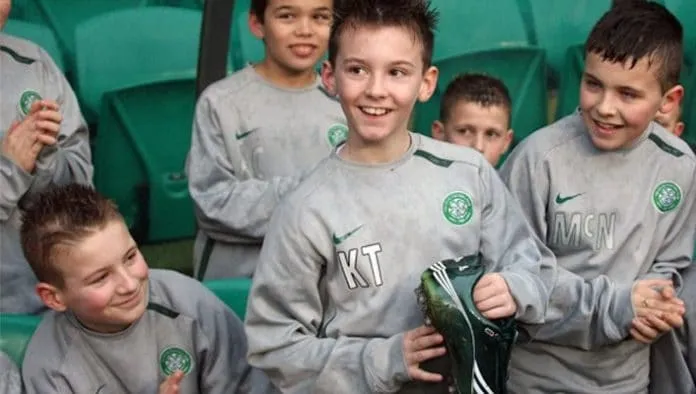 KT looks very excited as a young ball boy and academy player.