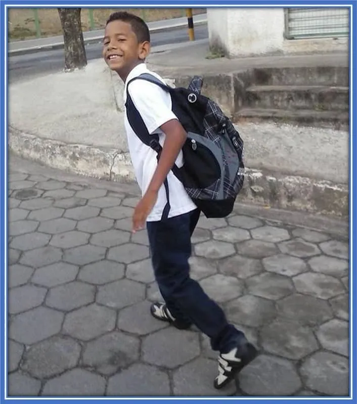 Little Savio all smiles as he heads to school.