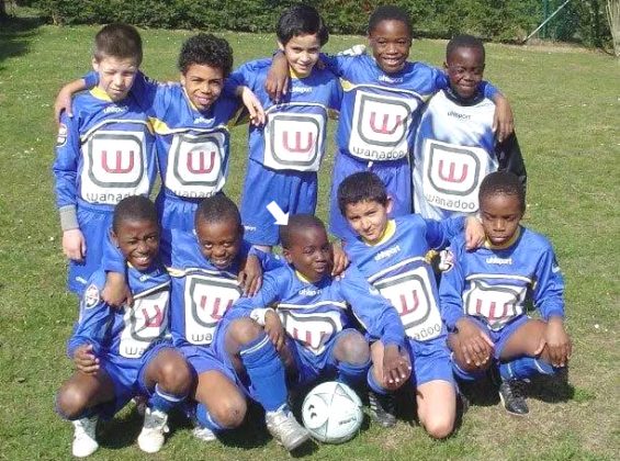 Foundations of a Star: A 6-year-old Ndombele in 2002, fuelled by passion, takes his first soccer steps with Epinay-sous-Sénart, a suburb club of Paris.