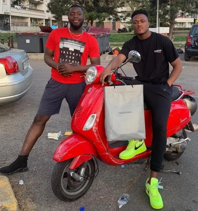 Zagadou loves shopping. See a photo of him posing with his friend after the activity.