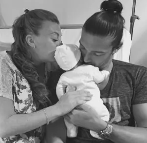 Billi Mucklow and Andy Carroll welcome their child to the world.