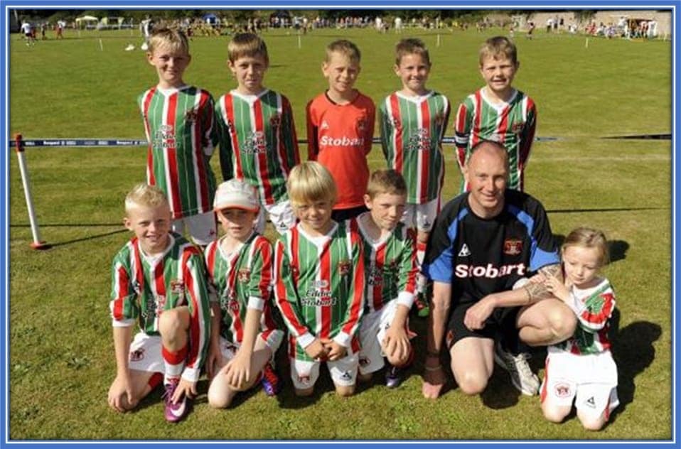 At the front left is Jarrad. His best friend, Liam Lightfoot, is at the back left. The boys took a photo with Carlisle United Under-9s. The boys were just about to participate in a Harraby Catholic Football tournament at Gillford Park.