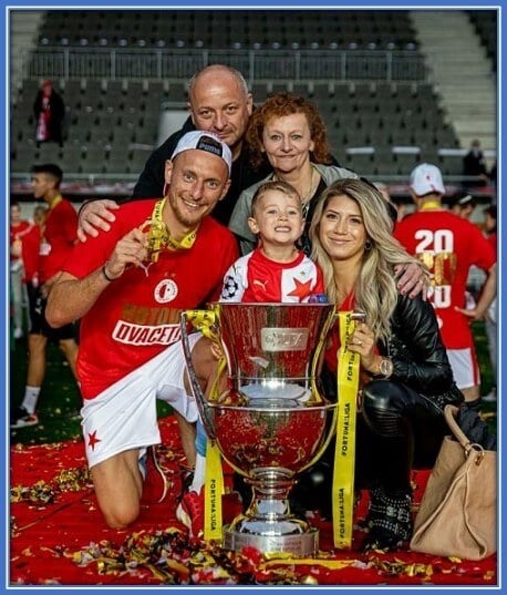 A rare photo of Coufal, his parents, wife and son. It is not often that he gets to take pictures with his family.