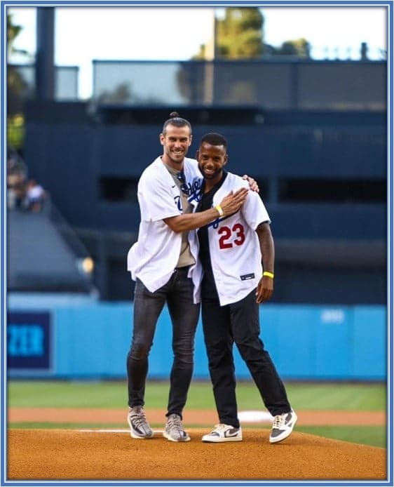 The defensive player and Gareth Bale are enjoying their time at a ballpark.