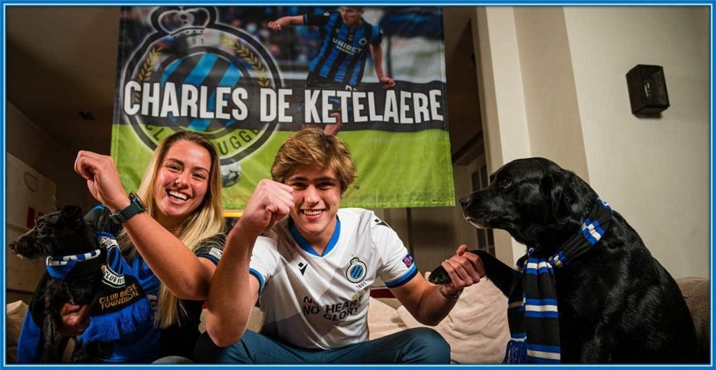 Meet the twins - Louis and Renée De Ketelaere and their dog, cheering for their little brother.