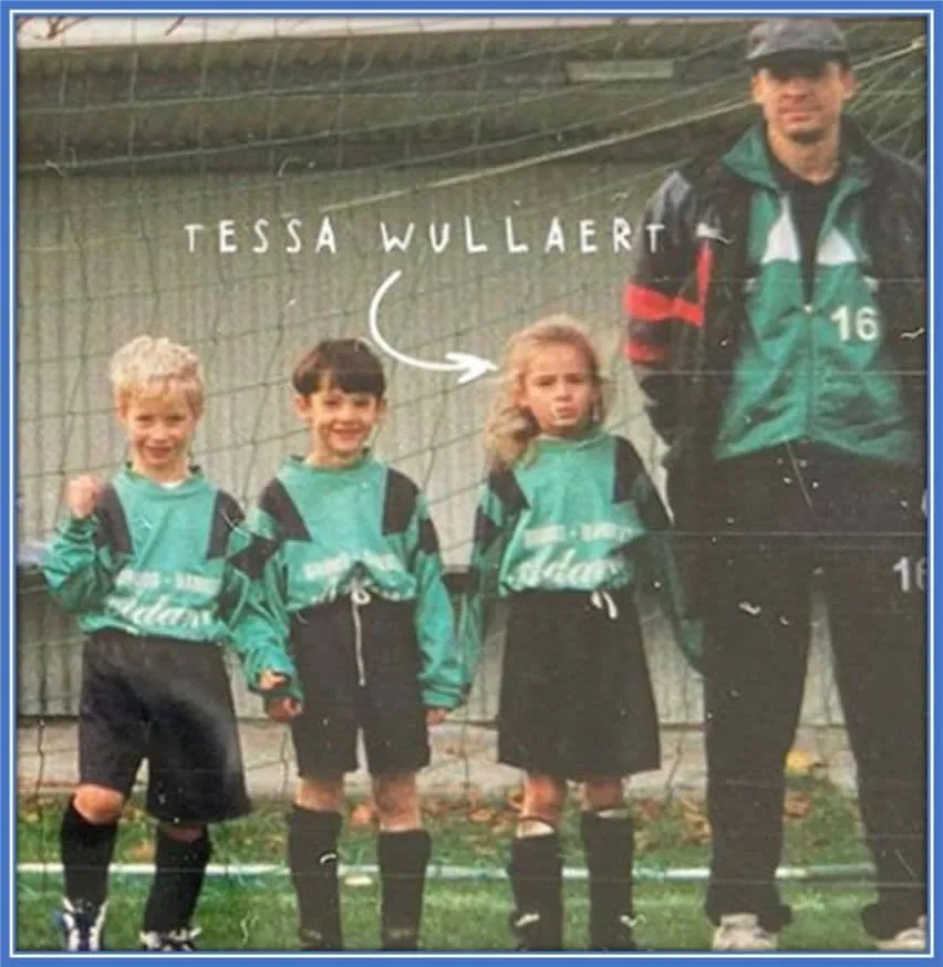 The dancer-turned-footballer (Tessa Wullaert) with her father and team members.