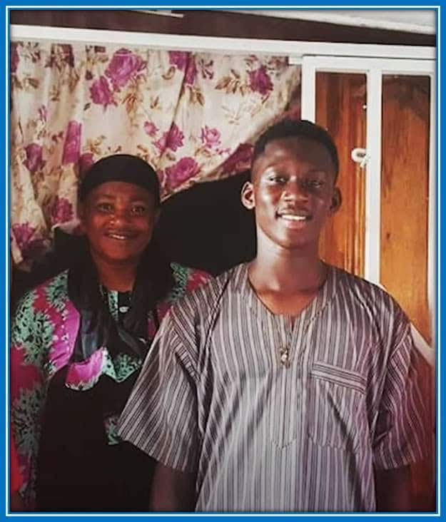 Meet Mrs Salisu as she Stands Beside her son. You can see that her first son got his looks from her.