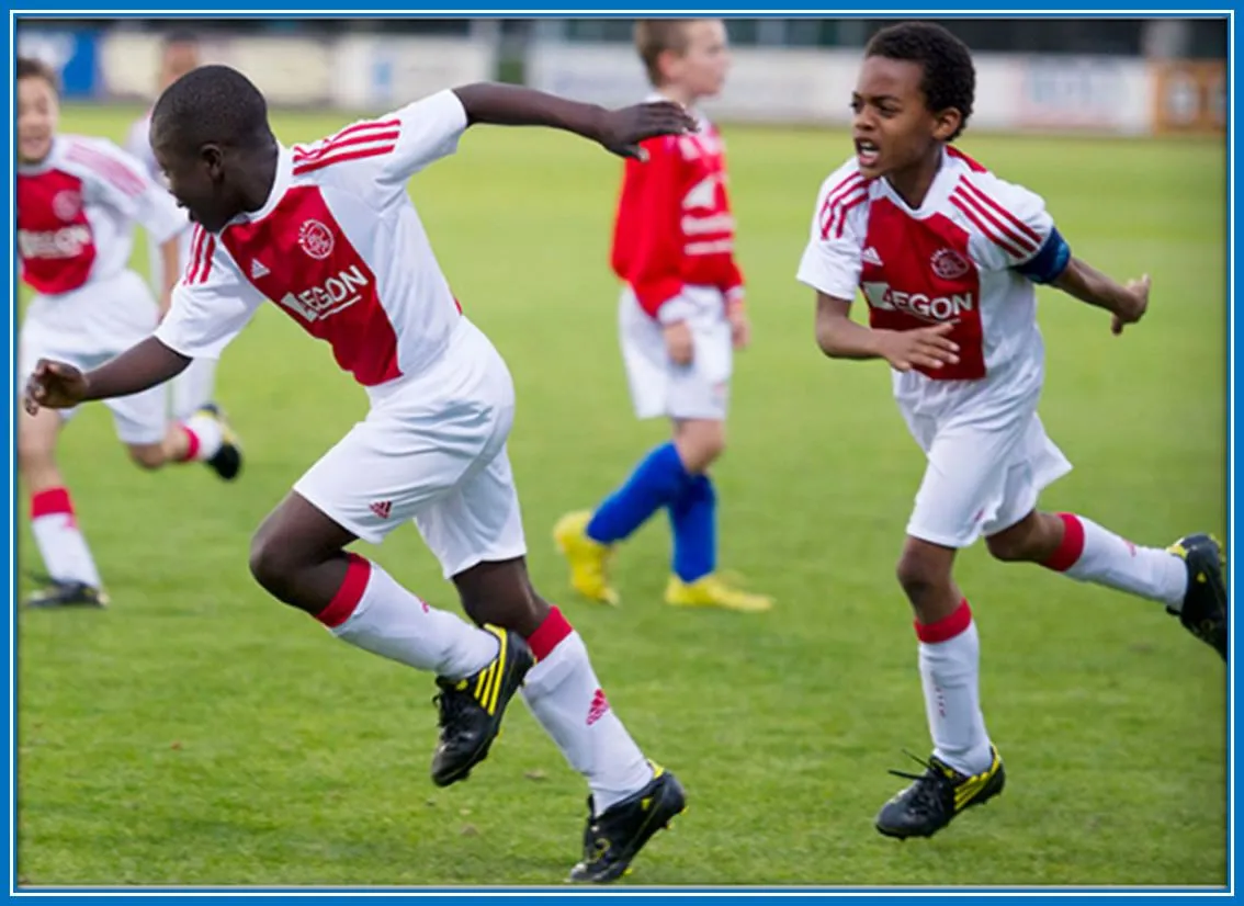 Here is the Young Brobbey with his best friend on the Pitch.