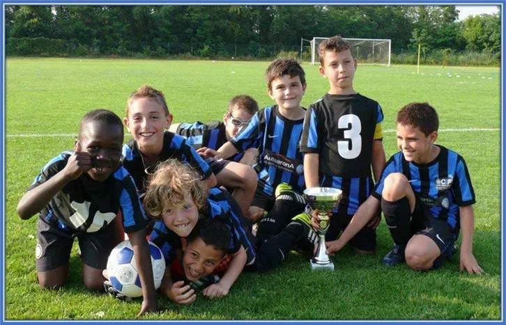 The Phenom is pictured alongside his teammates celebrating a trophy.