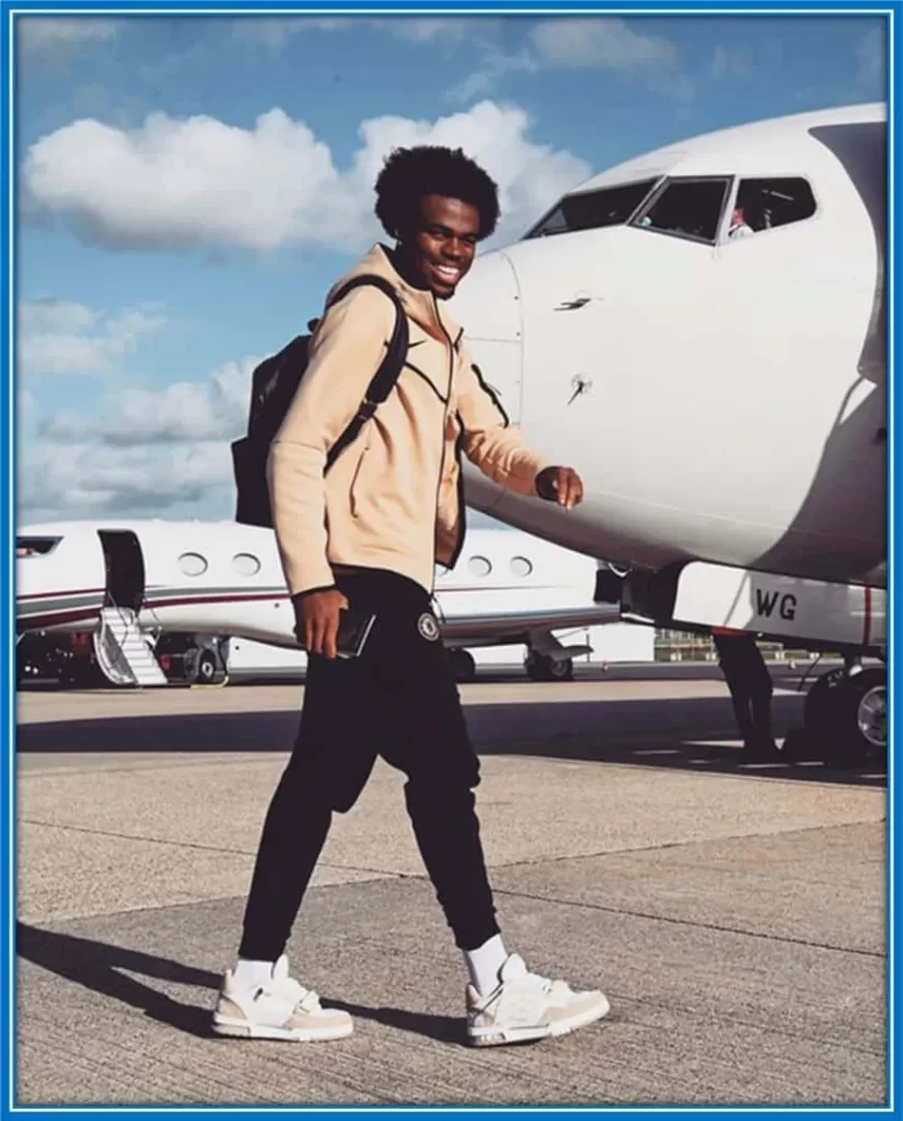 Rather than showcase his car, he would rather take a photo of himself while he is about to board a flight with his teammates.