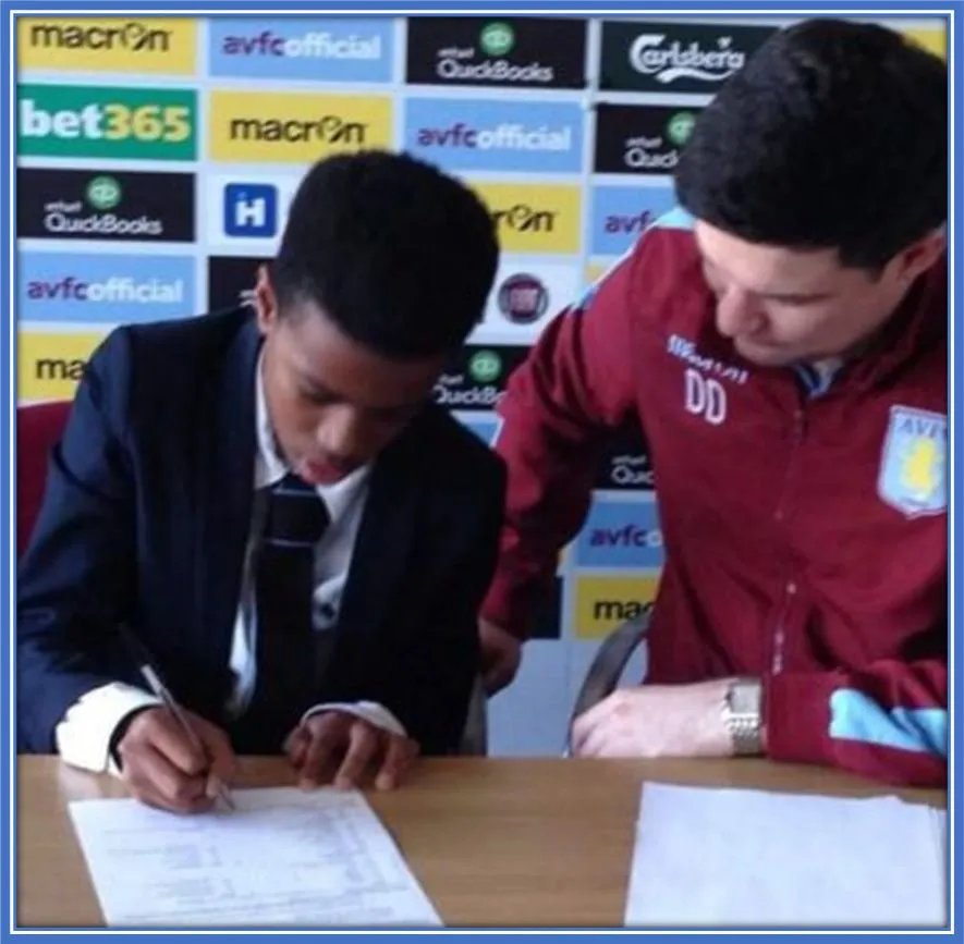 A rare photo of 12-year-old Carney Chukwuemeka just after he signed his first-ever contract for Aston Villa.