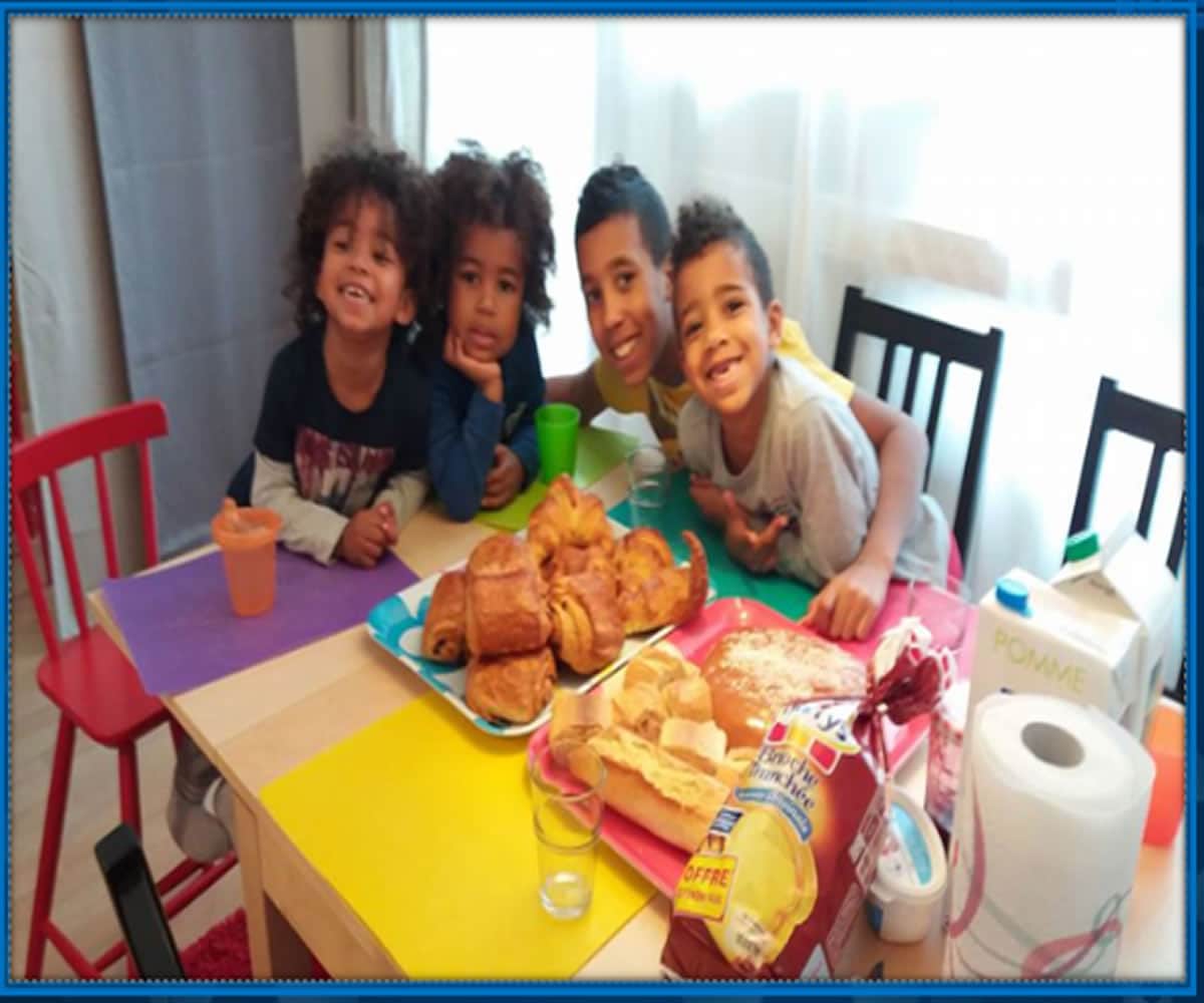 Leny Yoro's siblings as they assemble on the table for feeding by their mother. 