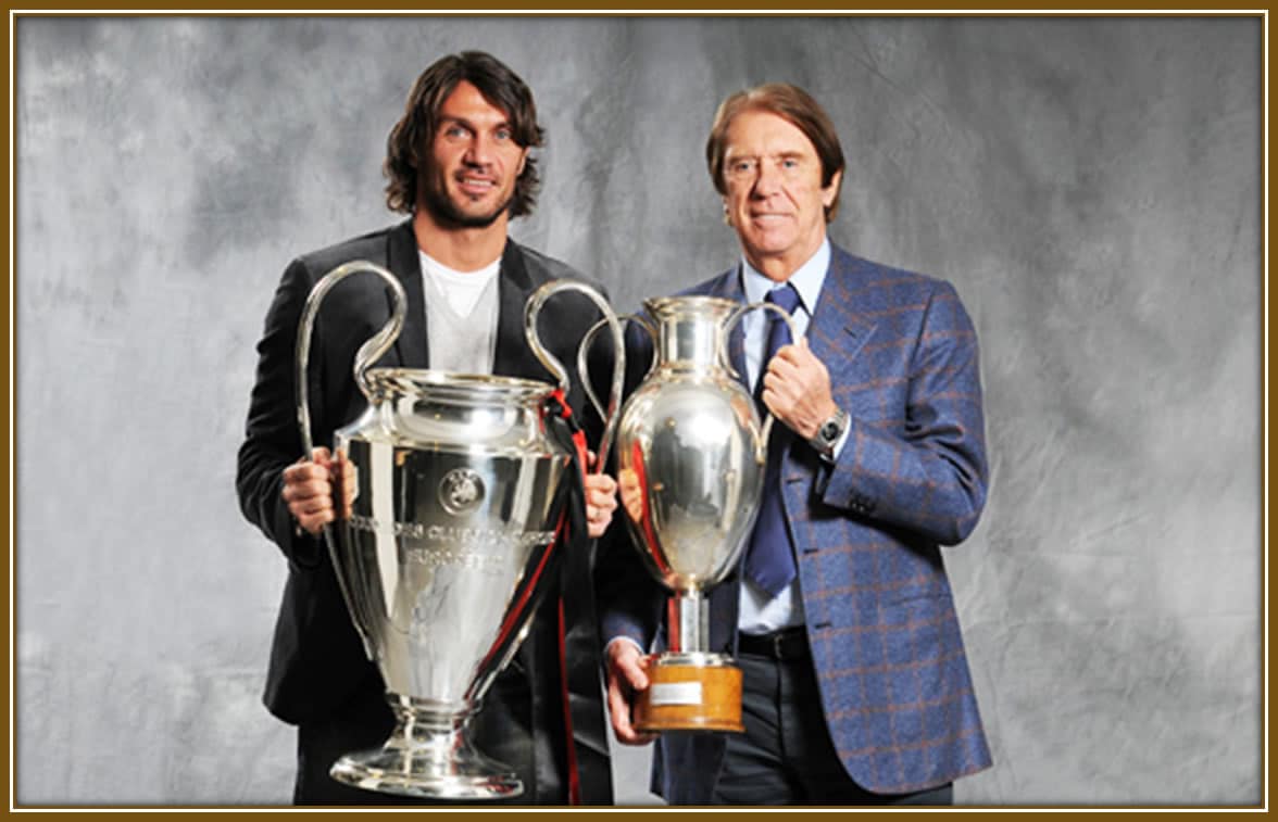 Paolo and Cesare Maldini proudly hold their European Cup and Champions League trophies, symbols of their remarkable achievements and dedication to the pinnacle of club football.