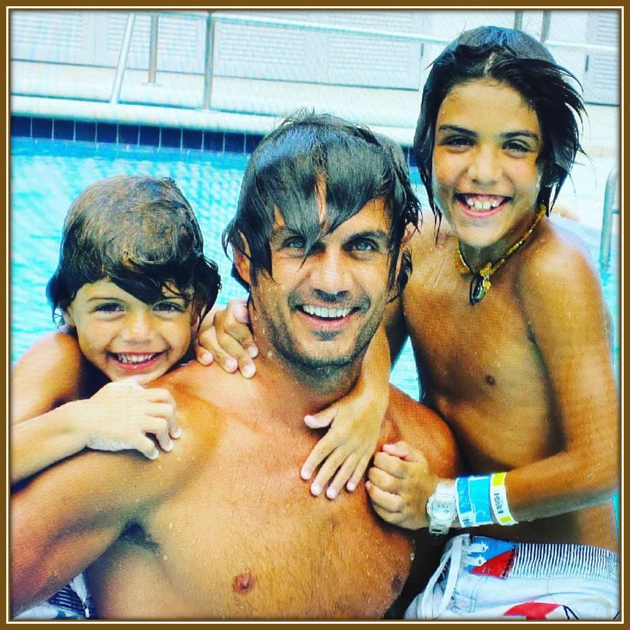 A joyful moment captured: Paulo Maldini splashes around with his sons, Christian and Daniel, creating cherished memories filled with laughter and love.