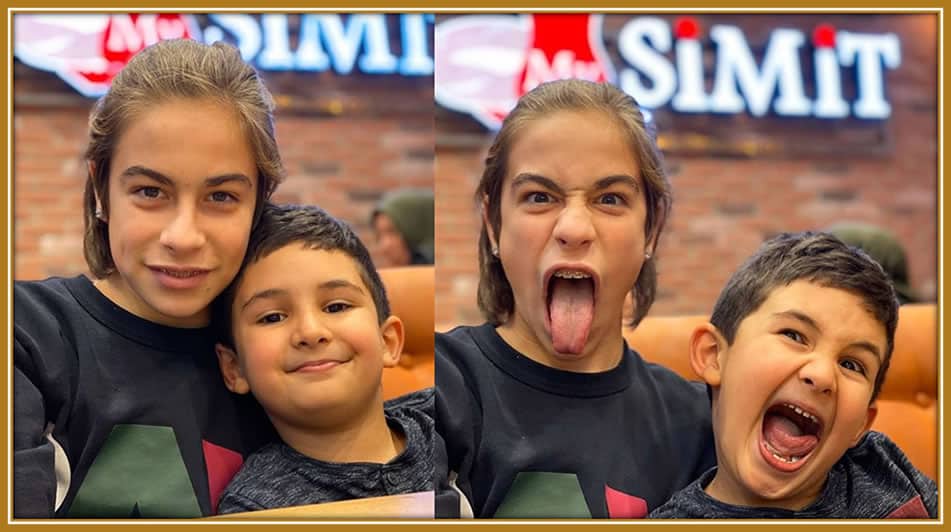 Kenan Yıldız and his little brother share a playful moment, sticking out their tongues and radiating pure joy during their childhood adventures!