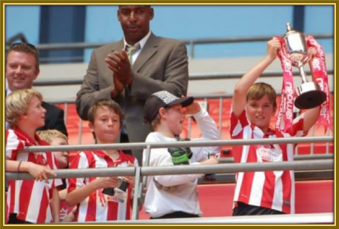 Look how the aspiring Premier League star holds up his trophy in a field performance