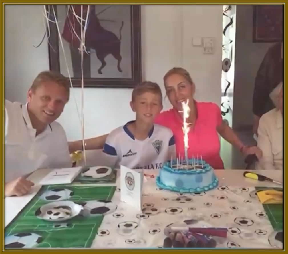 Celebrating little Dean’s special day with love and joy—his parents marking another year of blessings and memories, with football always in the background. 