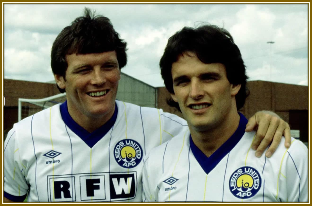 A vintage photo of Eddie Gray (left) and Frank Gray (right), both legends who played for Leeds United and won multiple trophies together.