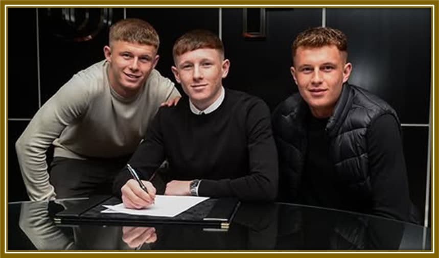 Family first, always. Will and Louis celebrating with Elliot as he signs his professional contract—a moment of pride, love, and togetherness.