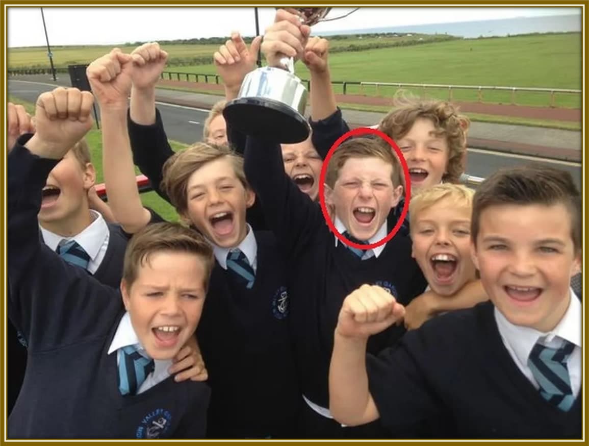 Future star spotted! A young Elliot Anderson beams with joy as he celebrates Valley Gardens Middle School's 2014 Danone Nations Cup victory.