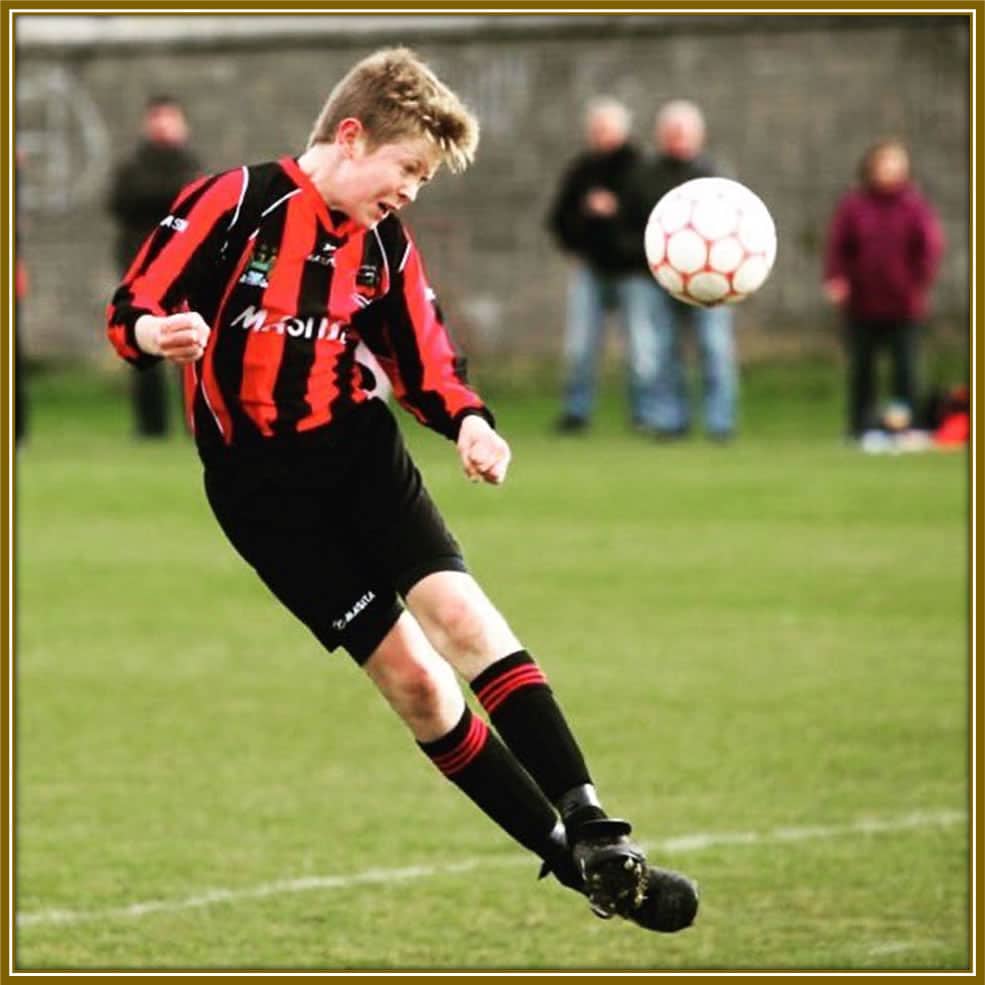 Fearless from the Start: Young Nathan Collins dominating the pitch with the mindset of a seasoned pro.