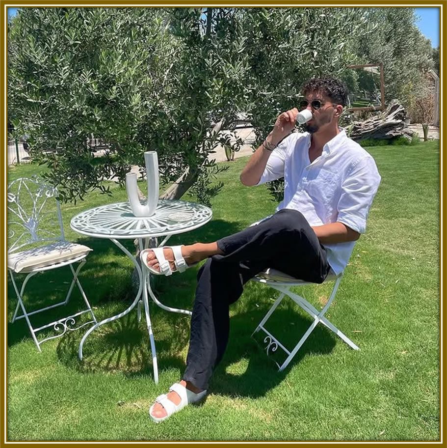 Altay Bayındır enjoys a peaceful moment, savoring a cup of tea and recharging his spirit in the serenity of his natural surrounding.