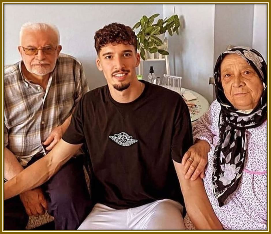 Wrapped in the warmth of love: Altay Bayındır, nestled between his grandparents, cherishing moments that matter most.