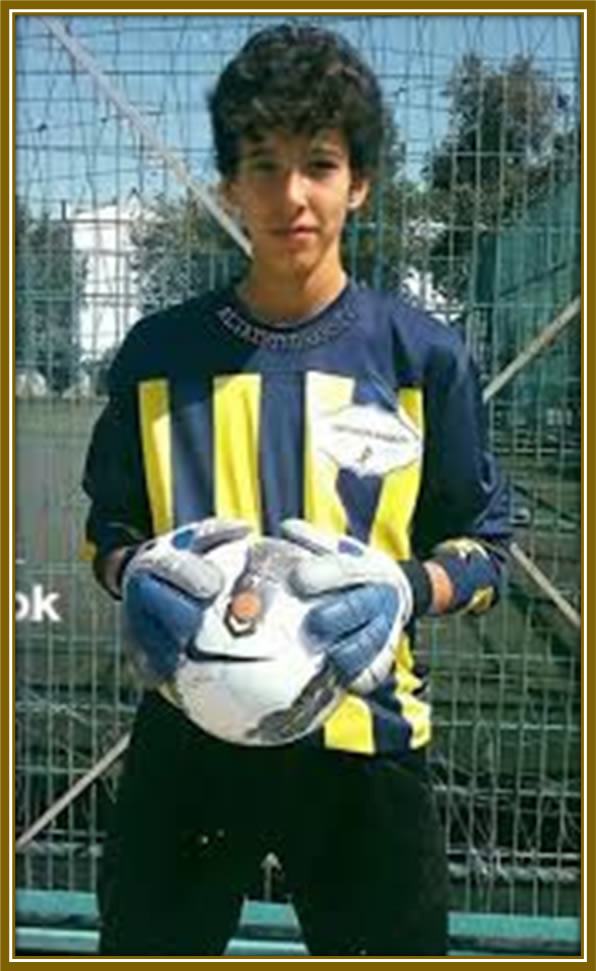 A picture of determination: Bayındır confidently grips the ball with both hands, ready to tackle any challenge that comes his way. A goalkeeper poised for greatness!