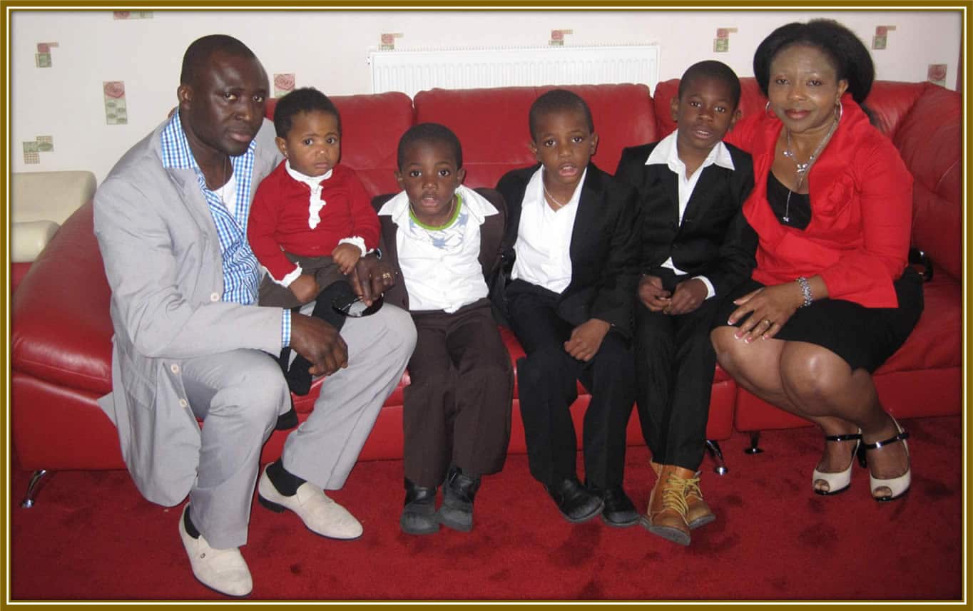 A young Patrick Dorgu with his family, pictured fourth from the left and third from the right. A moment of love and togetherness that shaped his journey.